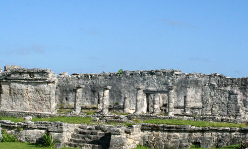 Old ruins of building against blue sky