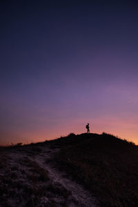 Scenic view of field against sky during sunset