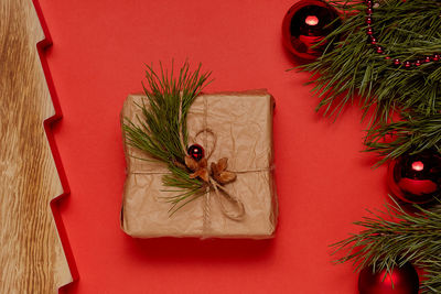 Directly above shot of christmas decorations on red background