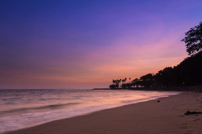 Scenic view of beach against sky during sunset