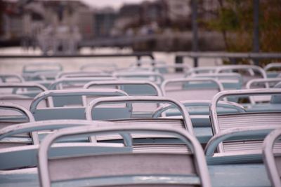 Empty chairs in swimming pool