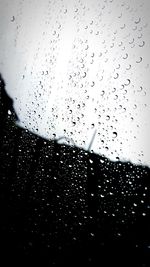 Close-up of water drops on glass