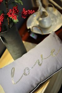 Close-up of hand on book at table