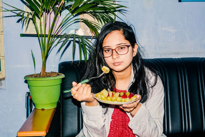 Portrait of young woman eating food. women need quality food for diet.