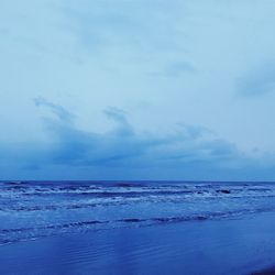 Scenic view of sea against blue sky