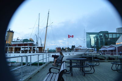 Boats moored at harbor