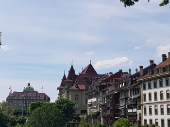 Buildings in city against sky