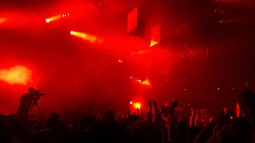 People enjoying music concert at night