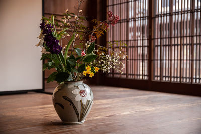 Close-up of potted plant on floor at home