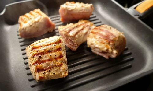 High angle view of meat on barbecue grill