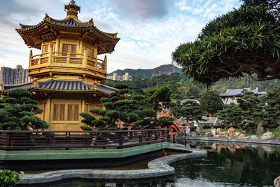 View of temple building by lake