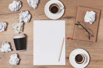 High angle view of coffee cup on table