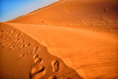 Footprints on desert landscape