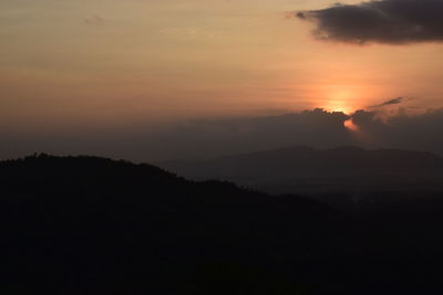 Scenic view of silhouette mountain against sky during sunset