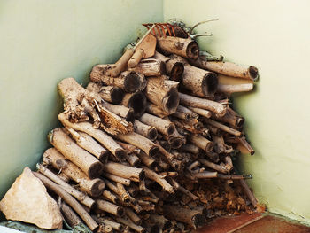 Stack of logs in wall corner at storeroom