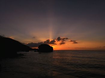 Scenic view of sea against sky at sunset