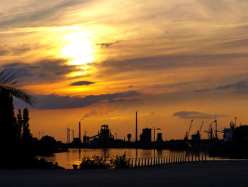 Silhouette of harbor at sunset