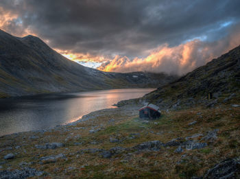 Scenic view of lake against sky during sunset