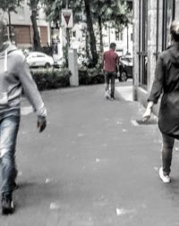 Full length of woman standing by railing