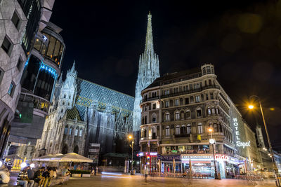 Illuminated buildings in city at night