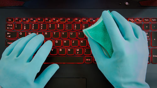 Close-up of hand using mobile phone