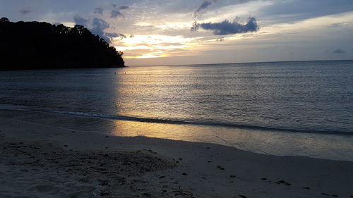 Scenic view of sea against sky at sunset