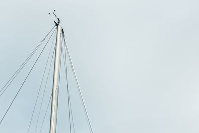 Low angle view of mast against clear sky