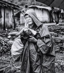 Portrait of young woman standing outdoors