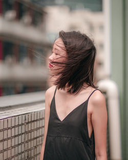 Close-up of young woman standing outdoors