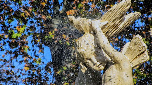 High angle view of statue against trees