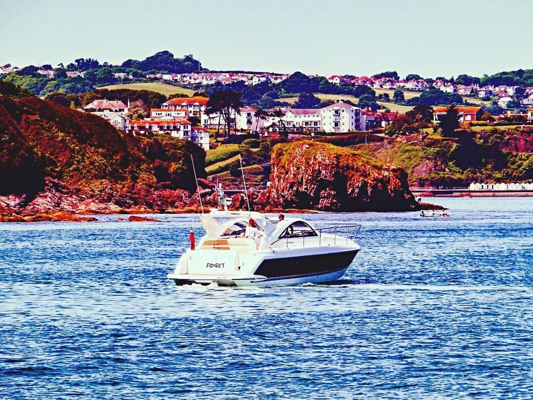 NAUTICAL VESSEL SAILING ON SEA AGAINST SKY