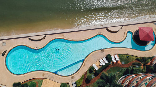 High angle view of swimming pool by sea