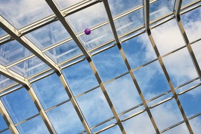 Low angle view of balloon and skylight