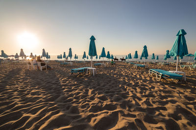 Panoramic view of beach against clear sky during sunset