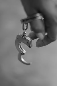 Close-up of hand holding cigarette