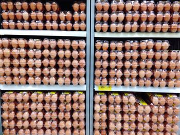 Stack of egg containers in shelf