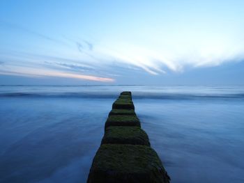 Scenic view of sea against blue sky