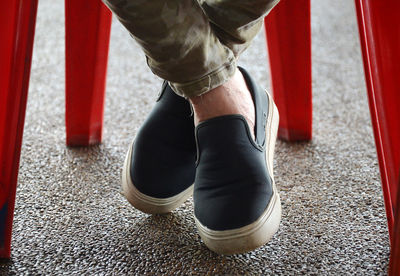 Low section of man standing on floor