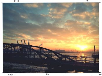 Silhouette of bridge at sunset