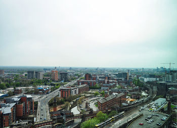 High angle view of city buildings against sky