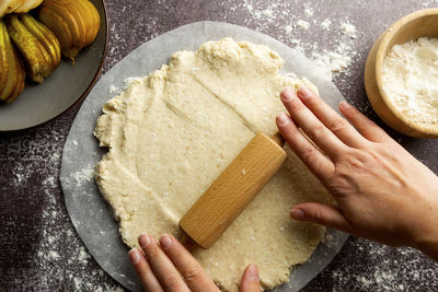 Midsection of woman preparing food at home