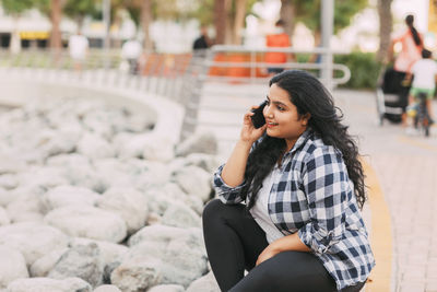 Young woman using mobile phone