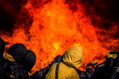 Firefighter against orange fire