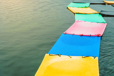 High angle view of multi colored boat on lake