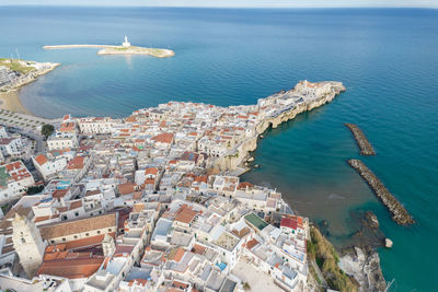 High angle view of city by sea