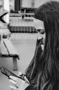 Close-up of woman using mobile phone