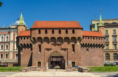 Facade of historic building against clear blue sky