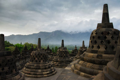 Borobodur temple against cloudy sky