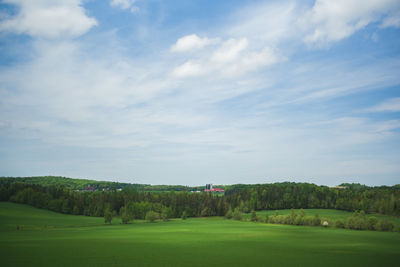 Scenic view of landscape against cloudy sky