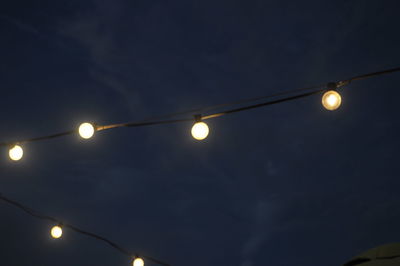 Low angle view of light trails at night